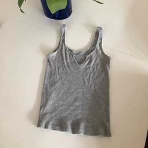 Grey Brandy Melville tank top with V cut out.